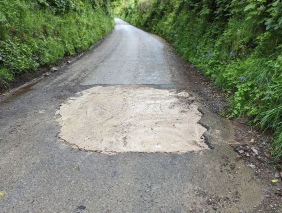 Highway officials searching for mystery motorist who filled huge pothole with concrete 1