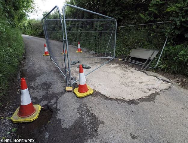 Highway officials searching for mystery motorist who filled huge pothole with concrete 3