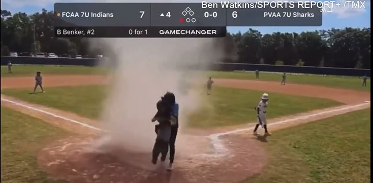  Florida umpire rescues 7-year-old engulfed by dust devil on the field 4
