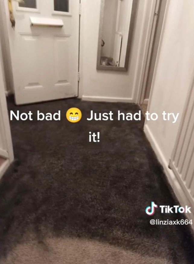 The woman painted her carpet black, people say it looks 'smoke damaged' 3