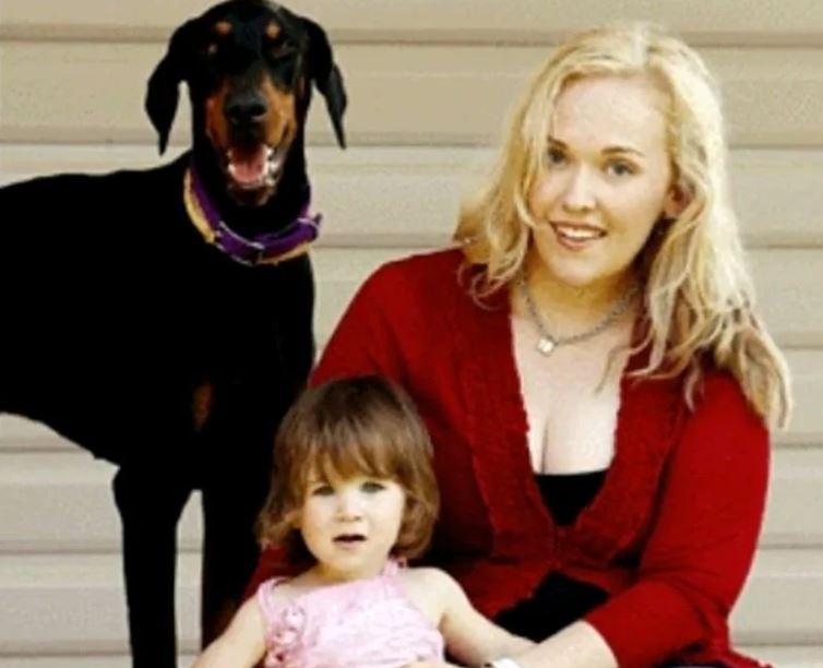 Family adopts abused rescue dog, and it repays by saving their daughter's life 1