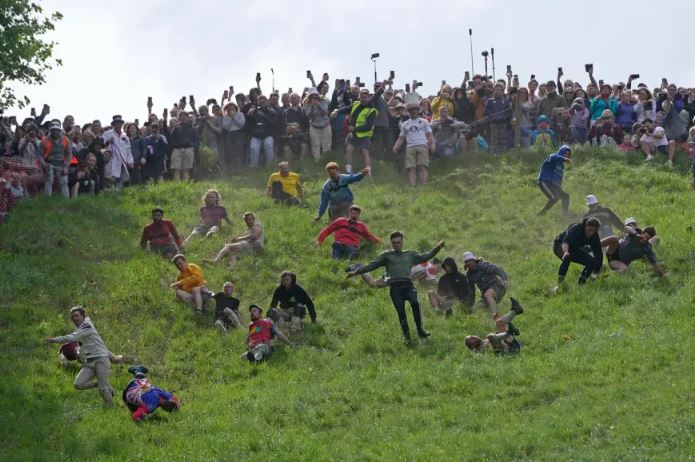 Canadian woman wins cheese rolling race despite being knocked unconscious 2