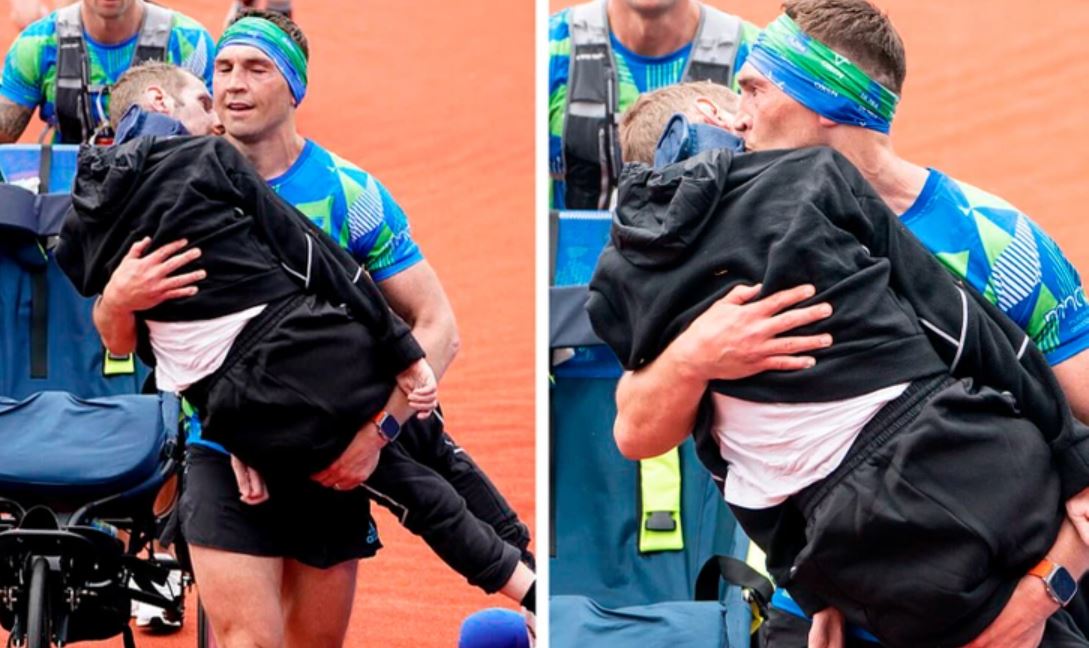 Man carries former teammate sitting in wheelchair to marathon finish line 4