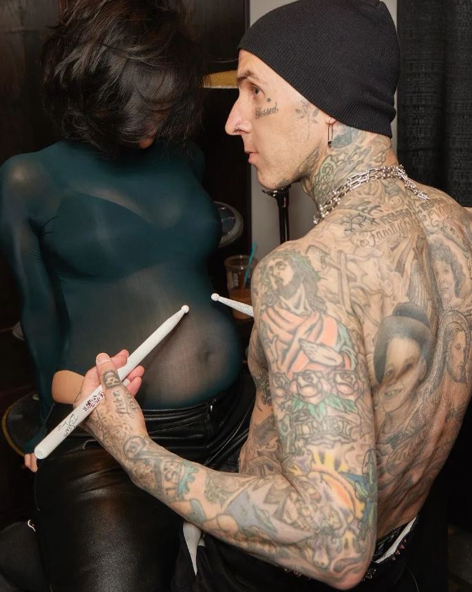 Kourtney Kardashian debuts baby bump in intimate photos after announcing pregnancy at husband Travis Barker's concert 3