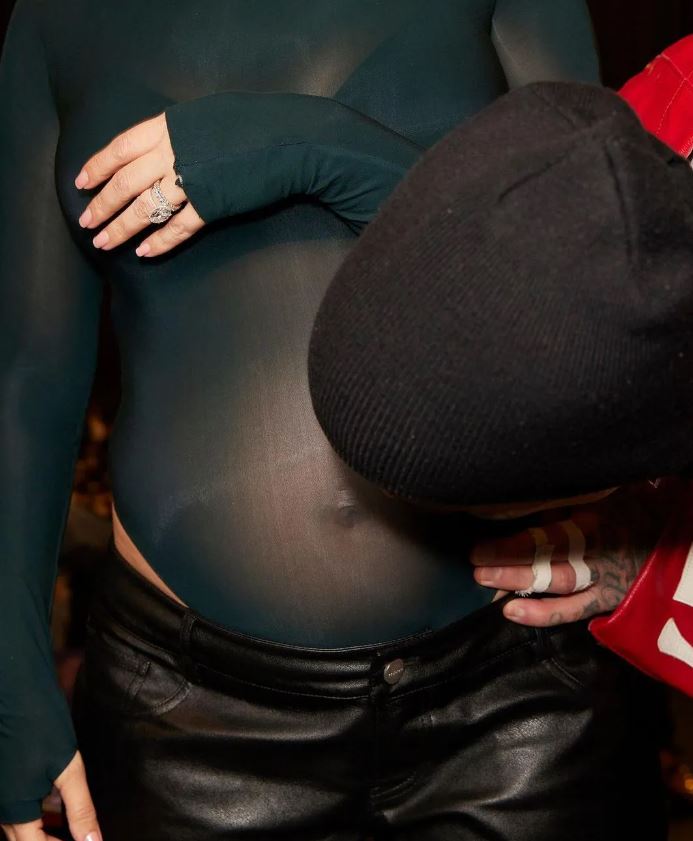Kourtney Kardashian debuts baby bump in intimate photos after announcing pregnancy at husband Travis Barker's concert 5