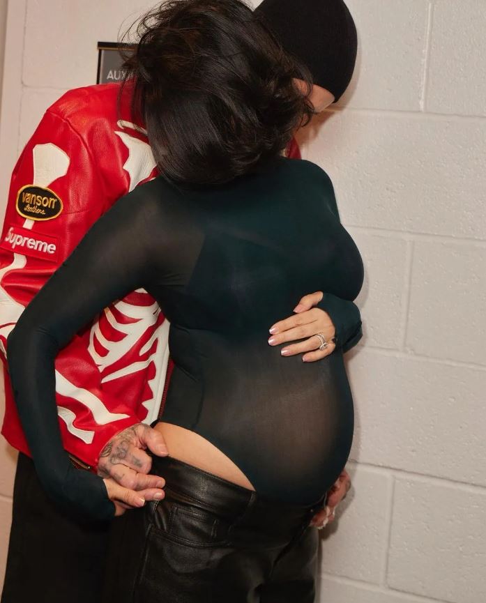 Kourtney Kardashian debuts baby bump in intimate photos after announcing pregnancy at husband Travis Barker's concert 6