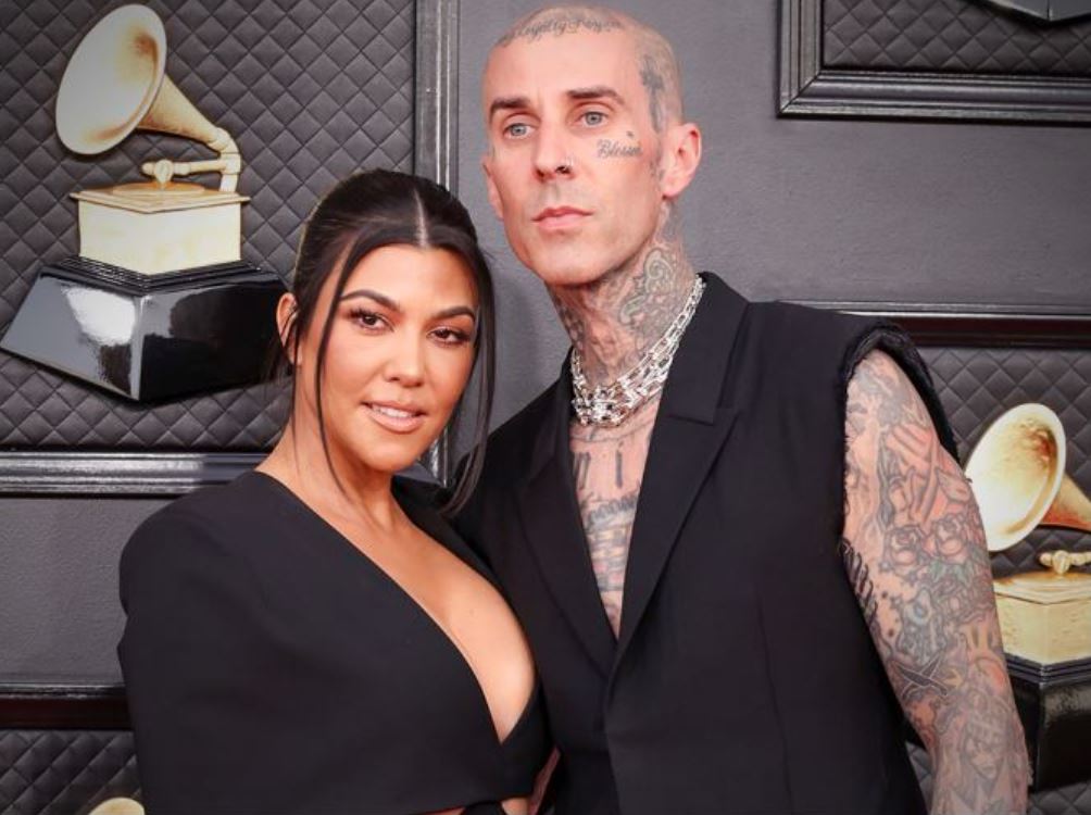 Kourtney Kardashian debuts baby bump in intimate photos after announcing pregnancy at husband Travis Barker's concert 7