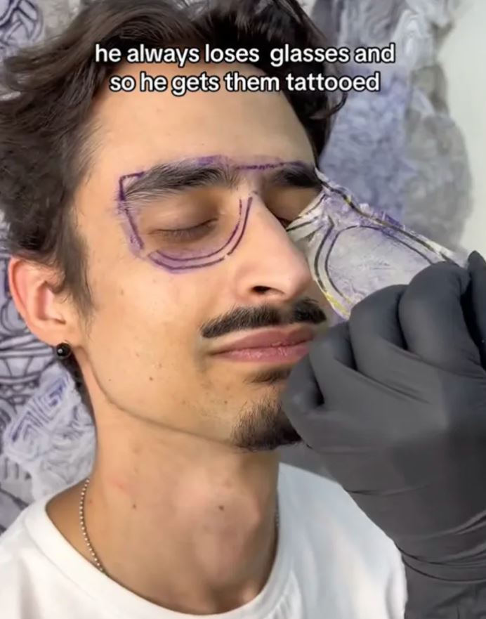 Forgetful man tattoos glasses on His face because he always loses them 2