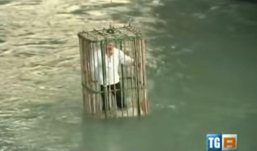 Town punishes unique politicians by putting them in a cage and dropping in the river 2