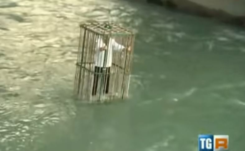 Town punishes unique politicians by putting them in a cage and dropping in the river 3