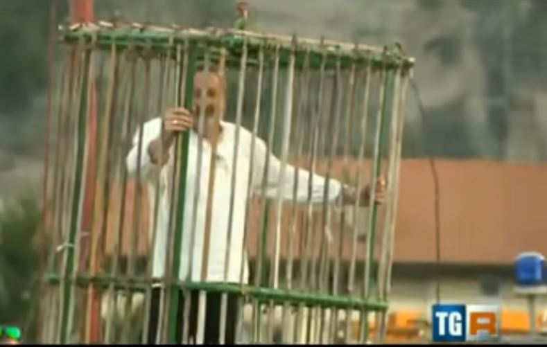 Town punishes unique politicians by putting them in a cage and dropping in the river 4