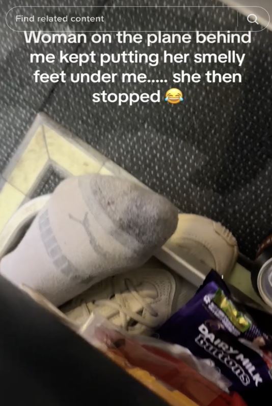 Fed-up man takes on ‘smelly feet’ plane passenger by pouring a drink on her toes 1
