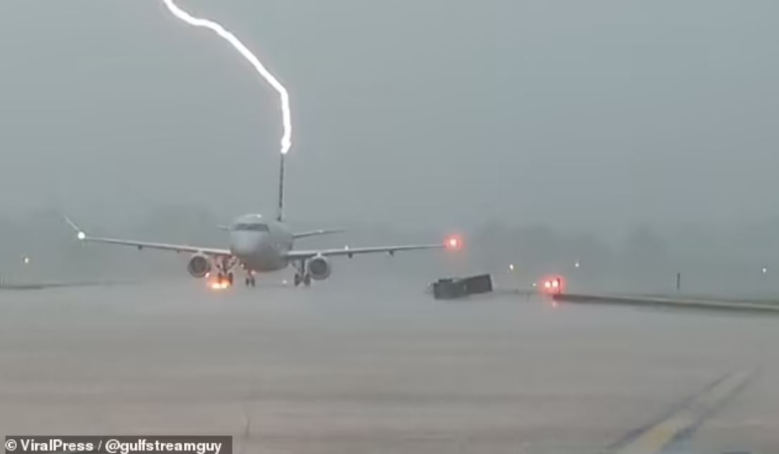 SHOCK moment: Lightning strikes plane full of passengers during stormy landing 1