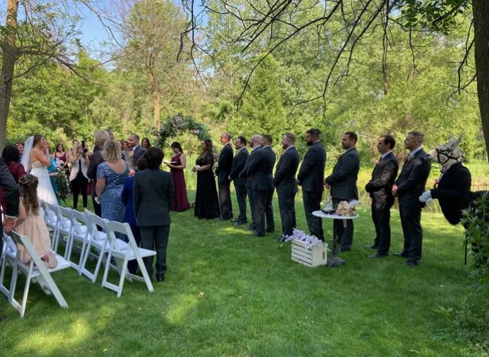 Llama dressed like groomsman at wedding delights guests at New York wedding 6