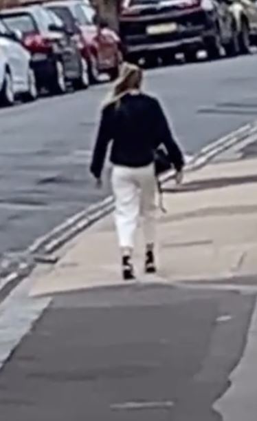 Millions freak out over woman who appears frozen in time while walking down the street 2