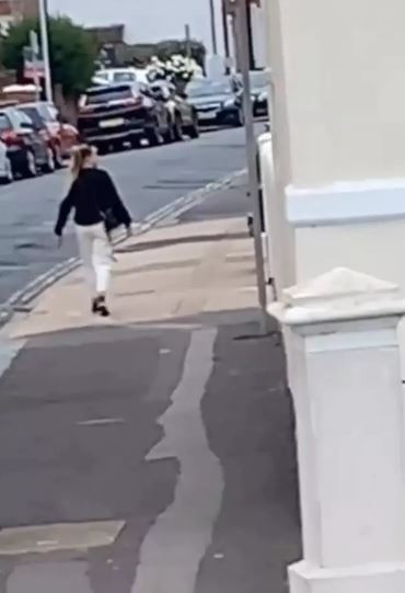 Millions freak out over woman who appears frozen in time while walking down the street 3