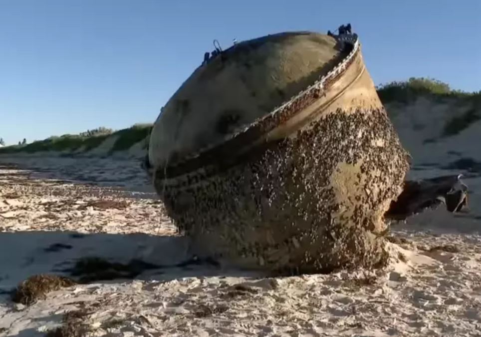Mysterious cylinder washes up on beach as officials urge public to stay away 2