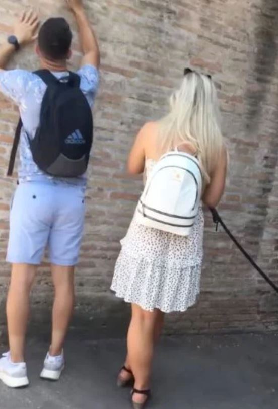 Teenage girl caught 'carving her initial into Colosseum wall' 9