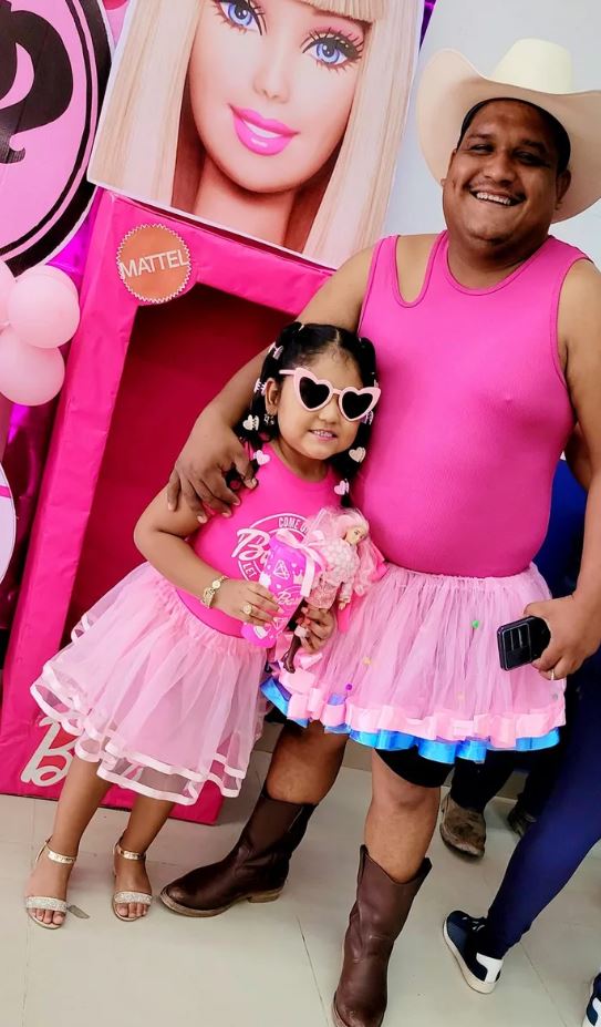 Proud dad praised for wearing pink dresses to watch 'Barbie' with his daughter 2