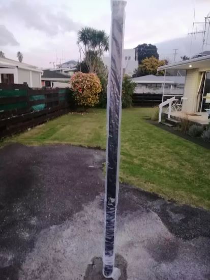 Woman was completely baffled after finding 6ft pole cemented into her driveway 1