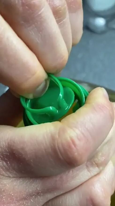 Tiktoker shares what the plastic pull tab on an oil bottle lid is for 2
