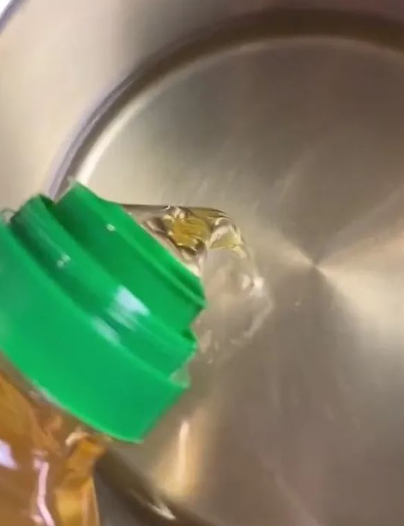 Tiktoker shares what the plastic pull tab on an oil bottle lid is for 3