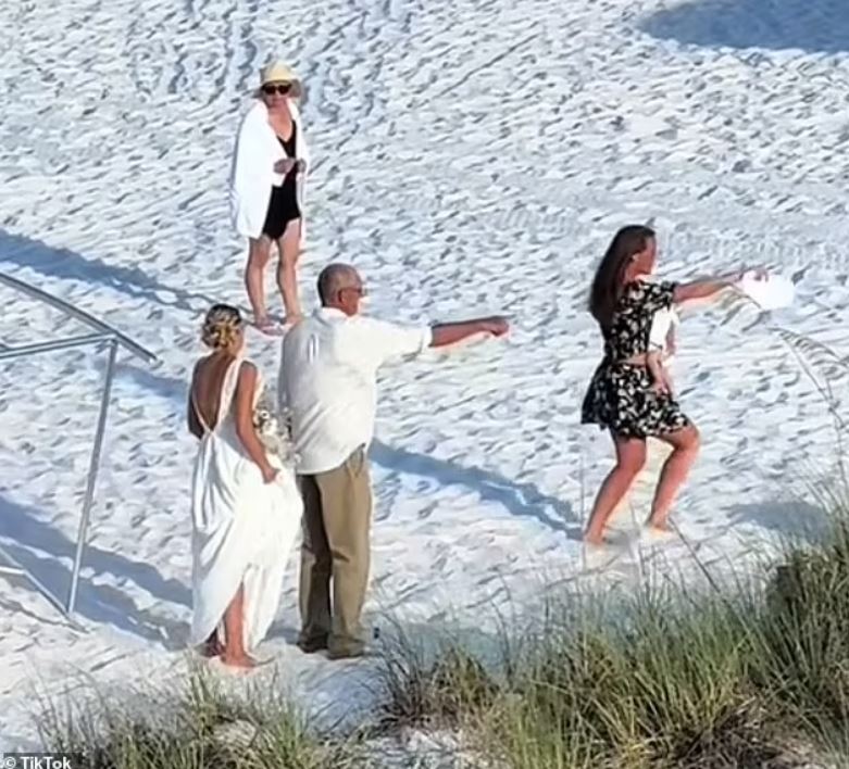 'Oblivious lady' sparks debate as she walked THROUGH a wedding on a public beach 4
