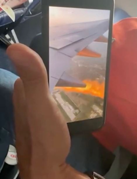 Passengers fearing 'it's gonna go down' after spotting flames shoot from underneath airplane 2