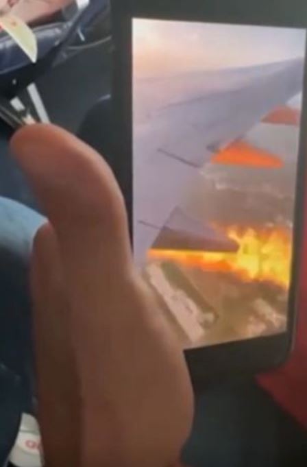 Passengers fearing 'it's gonna go down' after spotting flames shoot from underneath airplane 4