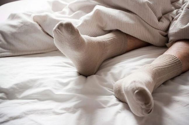 What might happen to your health if you sleep wearing socks? 1