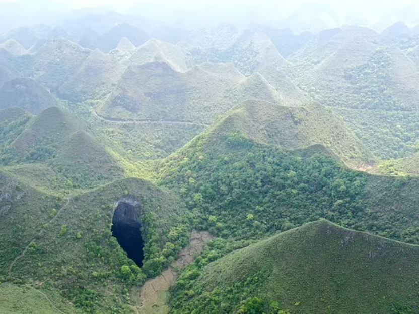 Huge ancient forest world discovered 630ft down below the surface in sinkhole in China 1