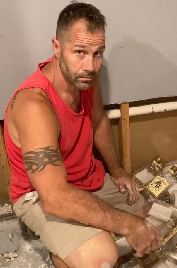 Couple was stunned after finding hundreds of empty rum bottles hidden behind home’s walls 1
