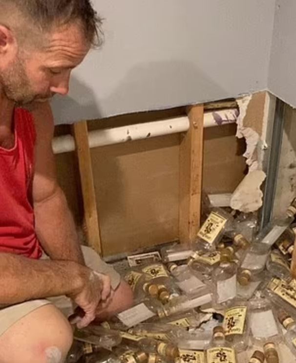 Couple was stunned after finding hundreds of empty rum bottles hidden behind home’s walls 2