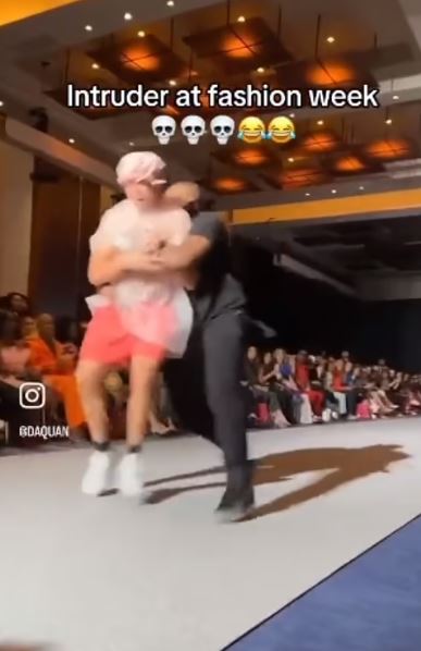 Nobody noticed an imposter wearing a TRASH BAG as he crashed the New York Fashion Week catwalk until security stepped in 3