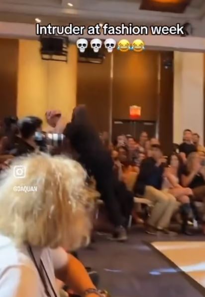 Nobody noticed an imposter wearing a TRASH BAG as he crashed the New York Fashion Week catwalk until security stepped in 4