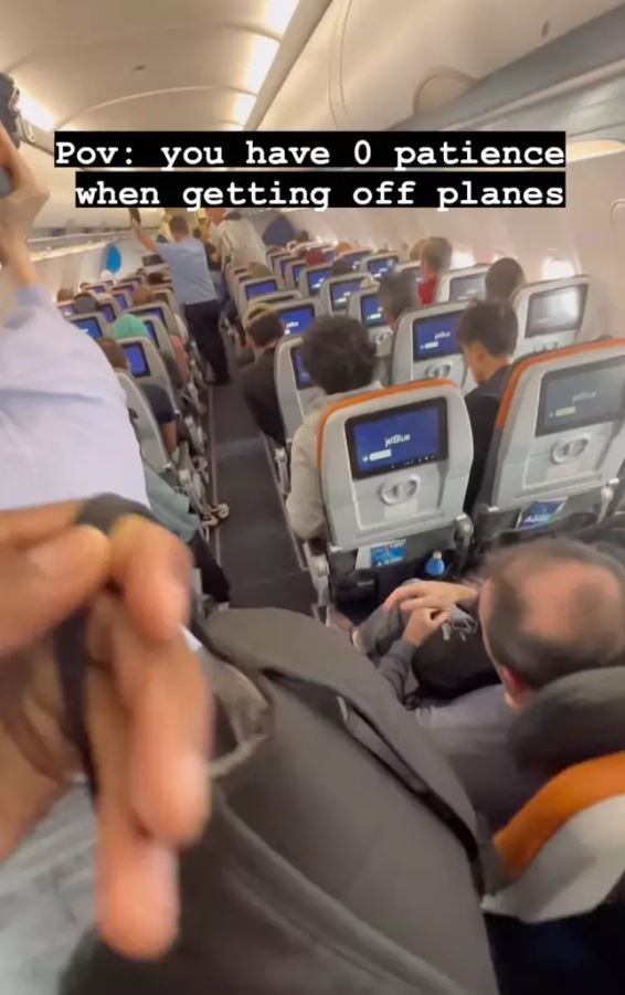 Man sparks debate after filming himself sprinting to front of the plane as it lands 3