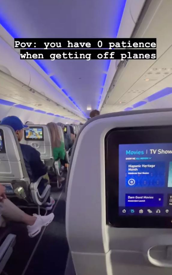 Man sparks debate after filming himself sprinting to front of the plane as it lands 2