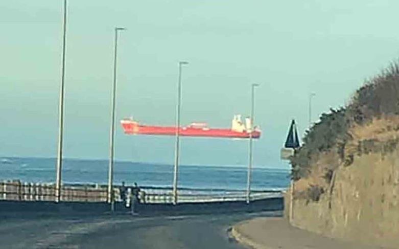  Ship appears to be sailing across the sky in bizarre optical illusion 1