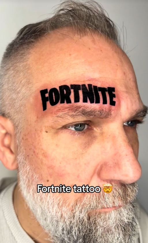 Dad gets a giant Fortnite tattoo on his face after losing a bet with his son 1