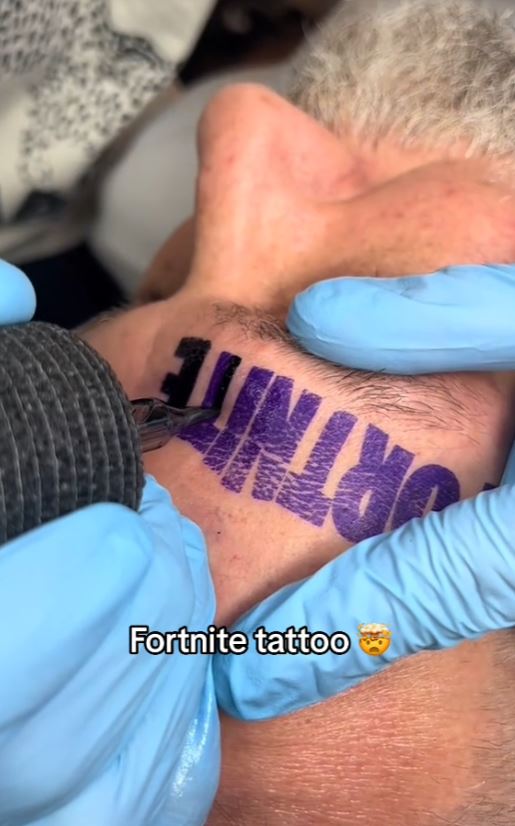 Dad gets a giant Fortnite tattoo on his face after losing a bet with his son 2