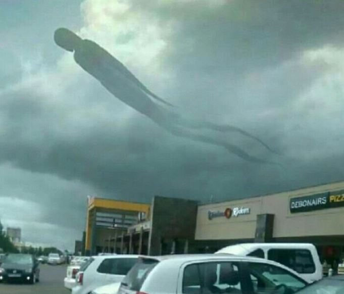 A strange human-like figure was captured in the sky at Mukuba Mall in Kitwe, Zambia, leaving residents scattered in terror. Image Credits: CEN