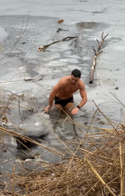 Brave man leaps into freezing lake to rescue trapped dog 5