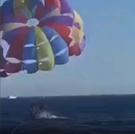 Camera captures moment shark leaps from ocean and attacks paraglider 3