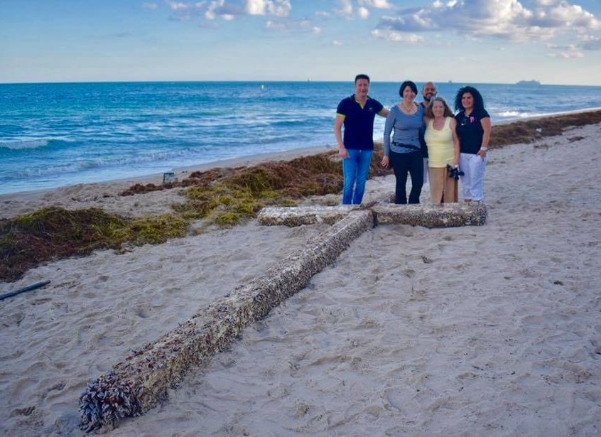 Beachgoer stunne after spotting a giant barnacle-covered cross washed up on a Florida beach 2