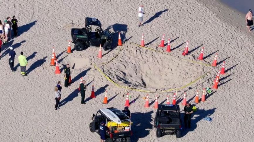 911 call reveals efforts to save girl who died after being buried in sand hole at Florida beach 2