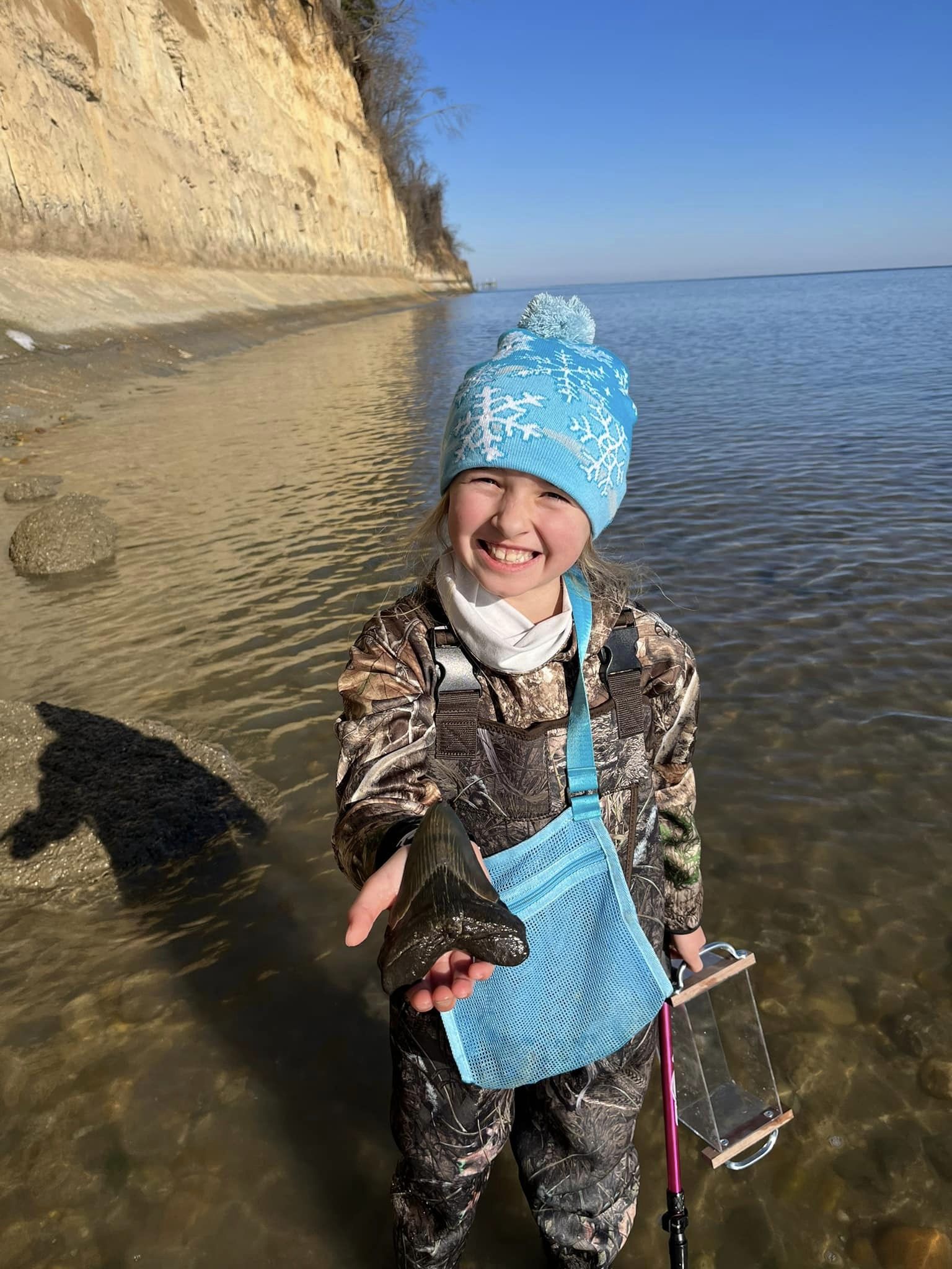 Molly Sampson, a 9-year-old girl, discovered a rare tooth from an Otodus megalodon shark. Image Credits: @Alicia Bruce Sampson/Facebook