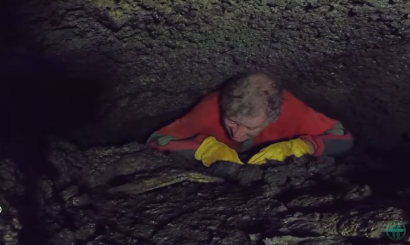 The footage showed the man filming himself getting stuck in an extremely tight cave, leaving several viewers breathless. Image Credits: @Caveman Hikes/YouTube.