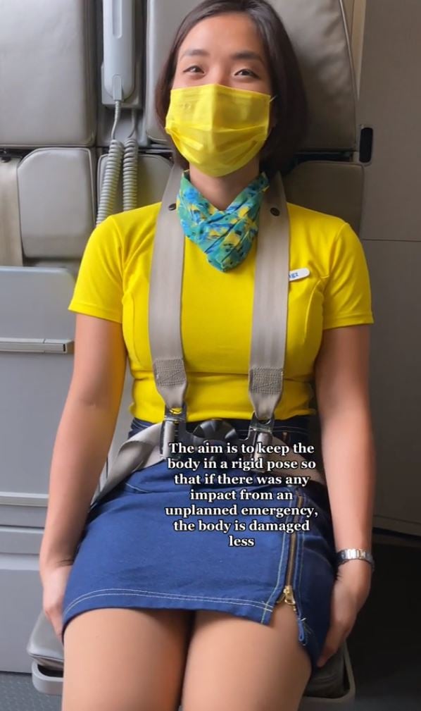 Why cabin crew sit on their hands during takeoff and landing: Flight attendant explained 4