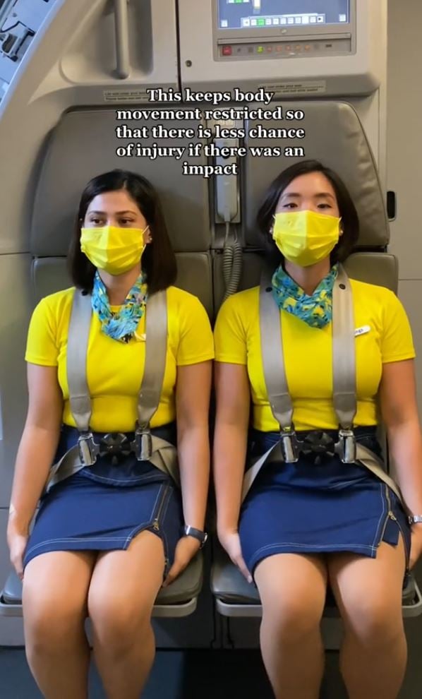 Why cabin crew sit on their hands during takeoff and landing: Flight attendant explained 5