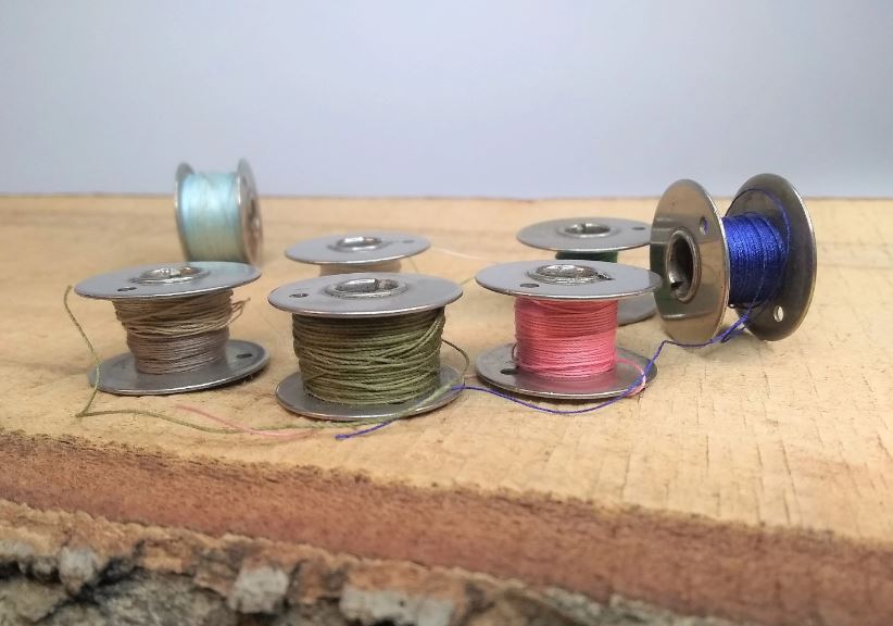 Unveiling the tales behind vintage sewing bobbins 5